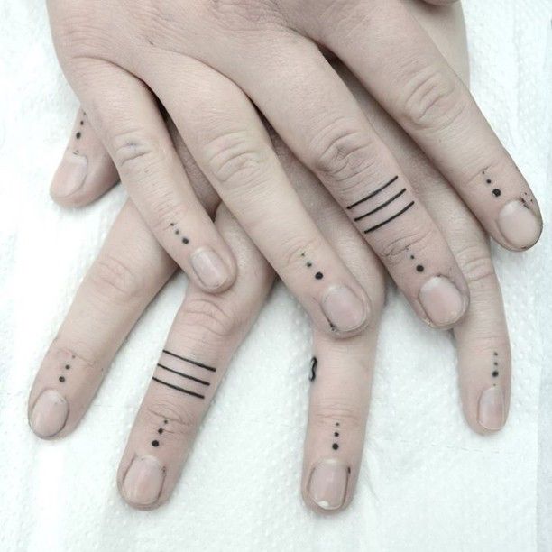 Dotted Finger Tattoo