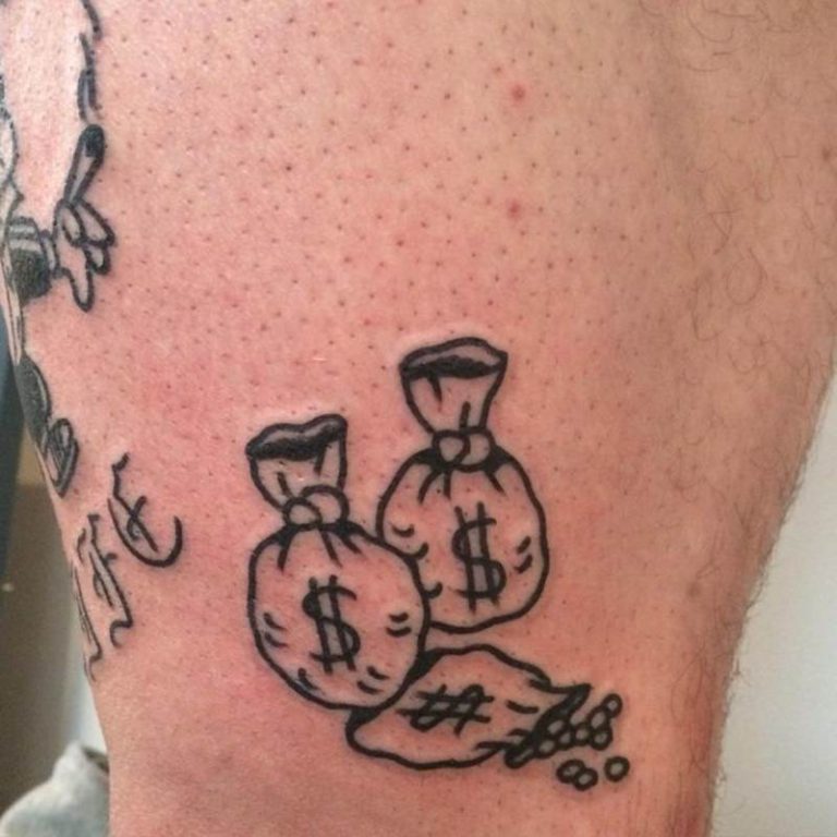 money tattoo that portrays the real and dark side of it, look no more as th...