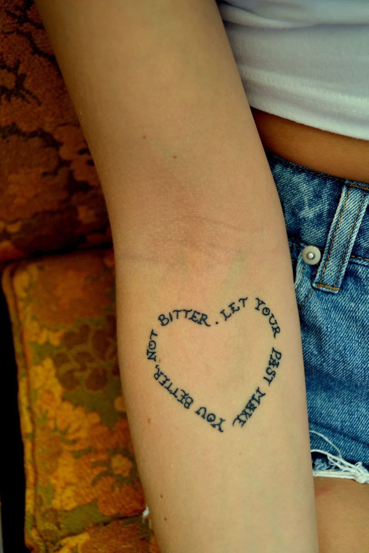 Heart-Shaped Quote Tattoo